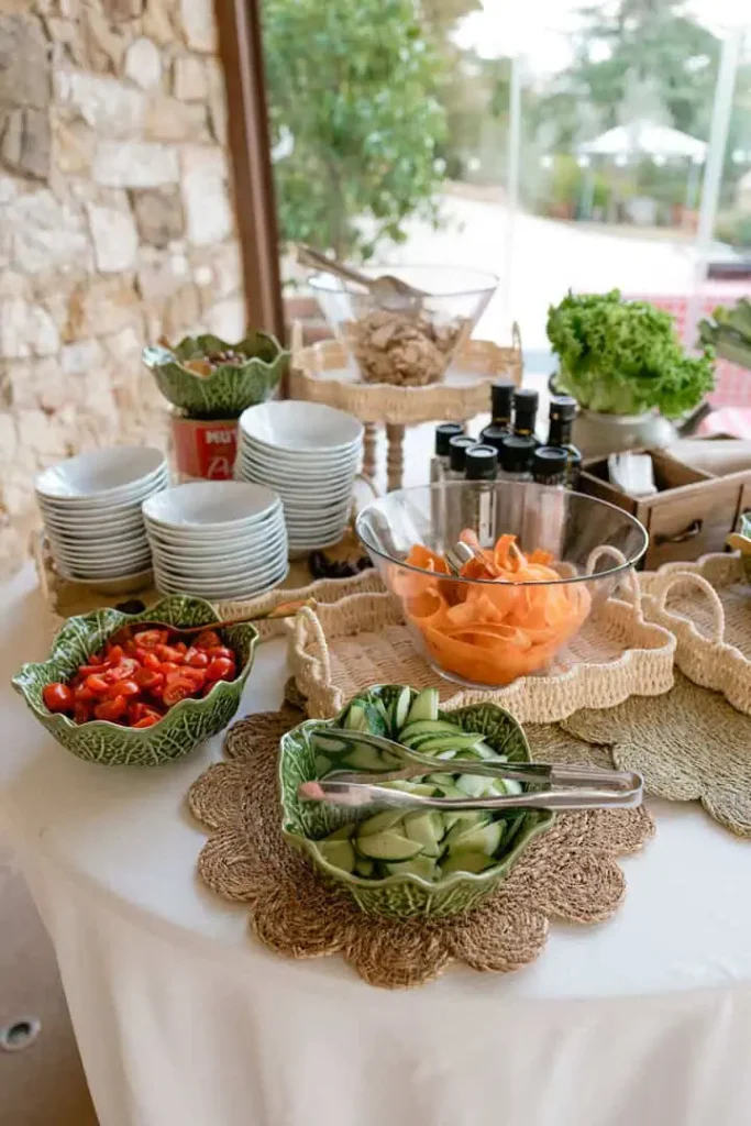 Fresh tomato, carrot and cucumber salads, placed in the show-cooking counter.